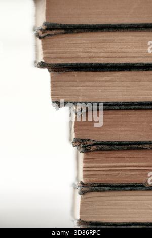 Stacked and worn hardcover books Stock Photo