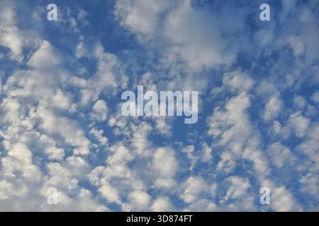 Clear blue sky with a few clouds Stock Photo