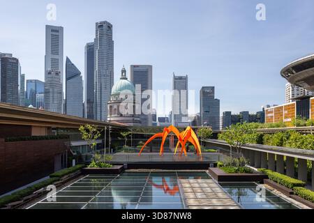 National Gallery Singapore Rooftop with skyline view and sculpture artwork within garden space at sunset Stock Photo