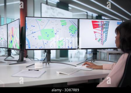 Engineers Using GIS Software Inspect Construction Project Valuation On PC. Stock Photo