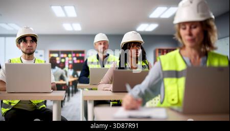 African American Woman Working On Laptop In University Chemistry Classroom. Stock Photo