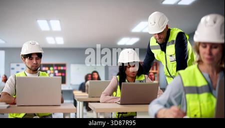 The Industrial Engineer Teaches Students Automated Processes In Classroom Setting. Stock Photo