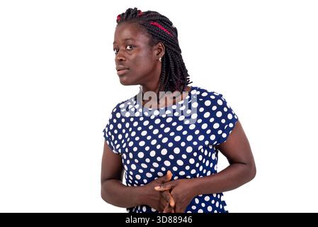 Young African woman wearing white blue camisole looking stressed and nervous with hands in hands on stomach looks with fear. Stock Photo