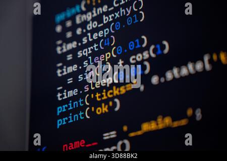 A detailed view of programming code displayed on a screen, featuring functions like print, sin, and cos, showcasing the syntax and structure of the code. Stock Photo