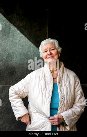 Portrait of smiling short haired senior woman wearing jacket Stock Photo