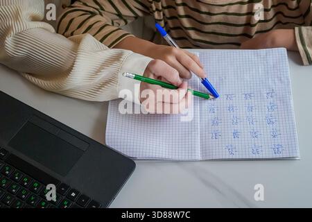 Close-Up of Hands Holding Pen and Notebook Stock Photo