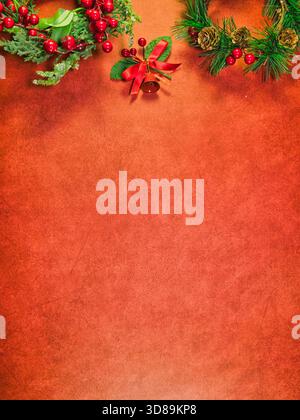 Festive Christmas Red Background Border - Vibrant Christmas border featuring festive pine, berries, bell, and a snowflake wreath on a textured red bac Stock Photo