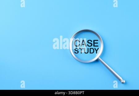 Case study concept. Magnifying glass focusing on text CASE STUDY, representing detailed analysis, research methodology, business insight, academic Stock Photo