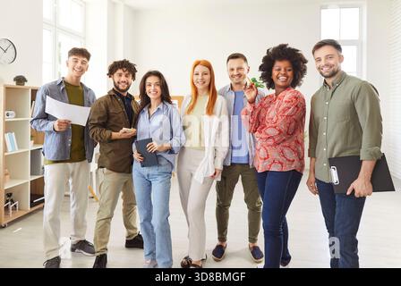 Portrait Of Happy Students And Colleagues Working As A Diverse Team In Office Stock Photo
