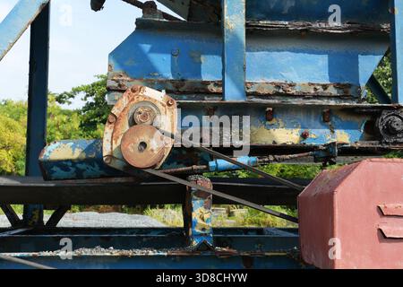 Capture the essence of enduring industrial design with this detailed machinery scene, featuring aged textures and striking blue hues in a captivating Stock Photo