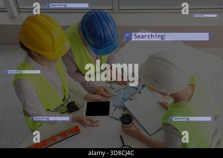 Team of constructors working in office and search fields on virtual screen Stock Photo