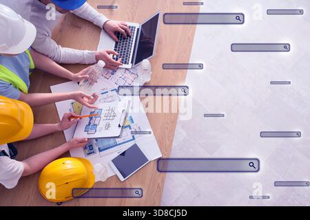 Team of constructors working in office and search fields on virtual screen Stock Photo
