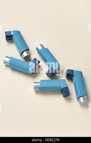 Asthma inhalers on beige background Stock Photo - Alamy