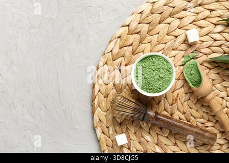 Composition with powdered matcha tea and accessories on grey background, closeup Stock Photo
