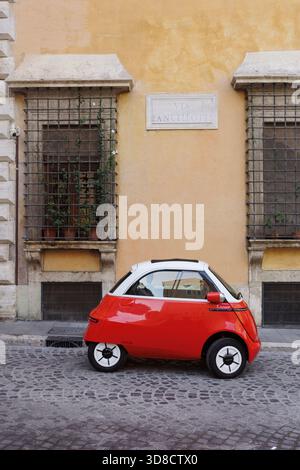 Mini Cars In Italy Rome. Italy. Microlino electric mini car parked in the historical ...