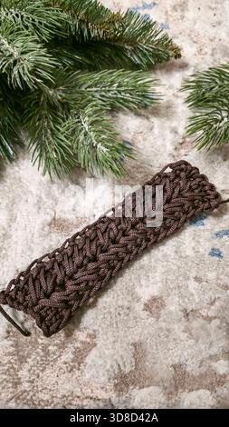 Knitting patterns for sweaters, hats, and other items using light-colored yarn on a light background. Copy space. Stock Photo