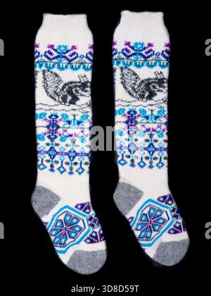 Multicolored socks on a black background. Stock Photo
