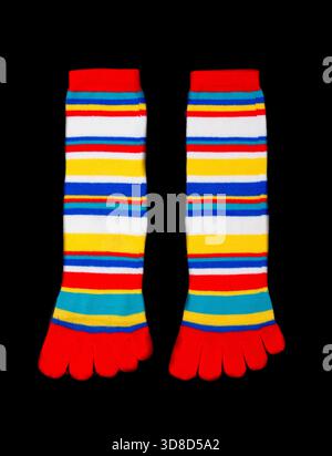 Multicolored socks on a black background. Stock Photo