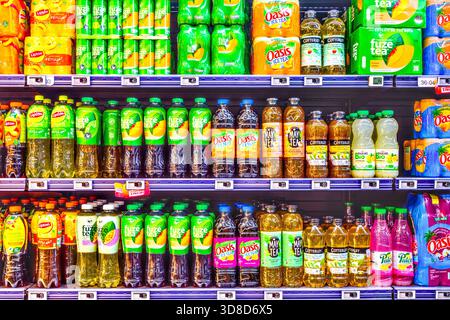 Intermarche supermarket display of assorted bottles and cartons of teas and other beverages - Yzeures-sur-Creuse, Indre-et-Loire (37), France. Stock Photo