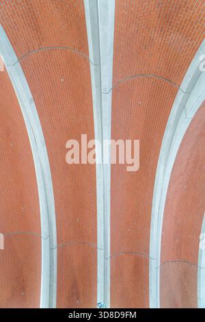 Melbourne, VIC, Australia. November 30, 2025. - The modern architectural brick arches and concrete ceiling details of Arden Station are prominently di Stock Photo