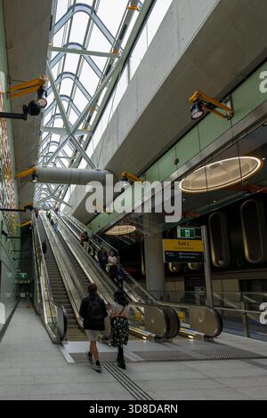 Melbourne, VIC, Australia. November 30, 2025. - Visitors ascend multiple escalators within Parkville Station on open day Stock Photo