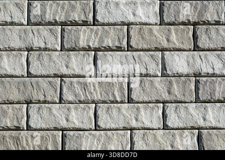 Background from a wall made of gray bricks Stock Photo