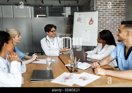 Chief physician holding digital tablet with blank screen Stock Photo