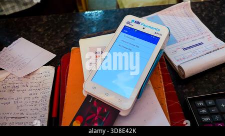 payments pos machine displaying charge slip options after card transaction image is taken at retail shop jodhpur rajasthan india on Nov 15 2025. Stock Photo
