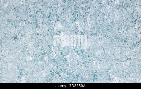 Light blue stone texture featuring an uneven marbled surface creating an abstract backdrop, suitable for backgrounds, natural material designs, and decorative concepts Stock Photo