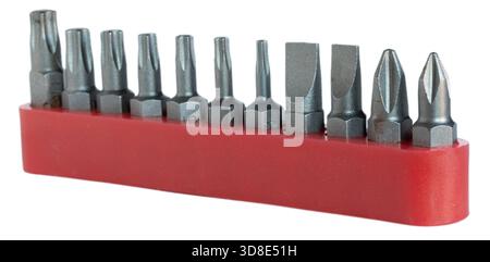 Red holder keeping a bunch of screwdriver and ratchet bits organized isolated on a white background. Stock Photo