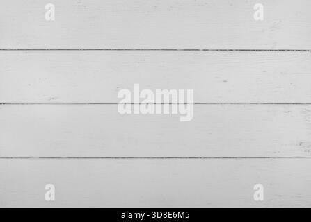White painted wooden planks are creating a beautiful rustic background texture, perfect for design projects and adding a touch of vintage charm Stock Photo
