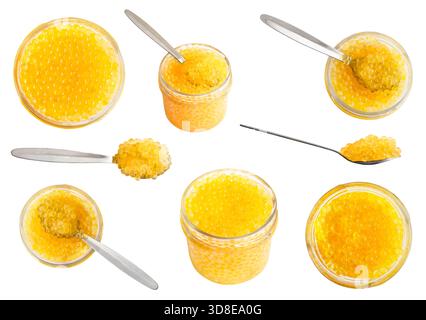 set of yellow caviar of river rainbow trout fish in can and spoons from Armenia cutout on white background Stock Photo
