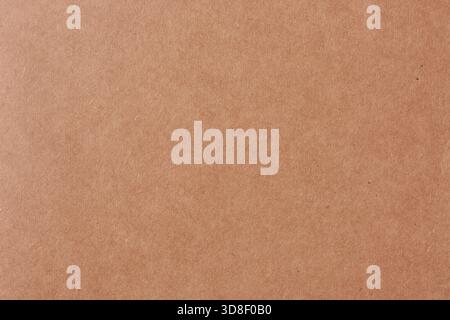 close-up of brown book cover texture, reddish-brown paperboard surface with grainy pattern, abstract background for design in full frame Stock Photo