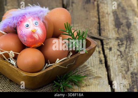eggs in a bowl on wooden background Stock Photo