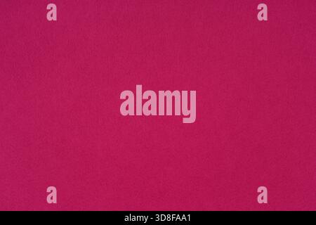 Crimson, bright pink felt background - close-up of the soft surface of the fabric. Seamless background, graphic design, scrapbooking, textile layouts. Stock Photo