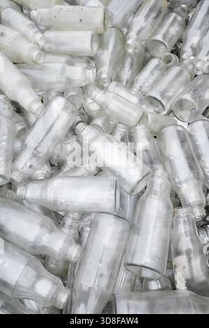 Photo of dirty, used glass bottles. Stock Photo