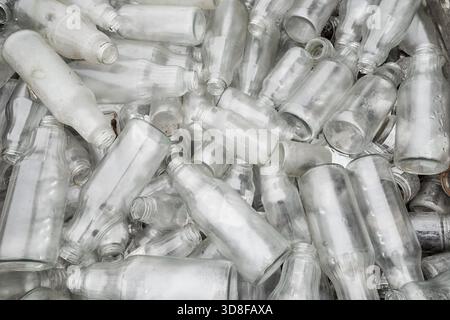 Photo of dirty, used glass bottles. Stock Photo