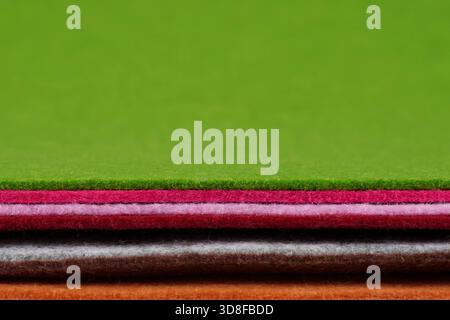 Colorful multicolored felt. The thickness is clearly visible. Space for text. Soft fabric samples. For design projects, textile layouts, sewing. Stock Photo