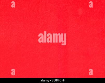 Red wall, background, texture. Smooth but a little shabby surface. Reddish plastic surface, backdrop. Red-colored plastic (polystyrene) covering Stock Photo