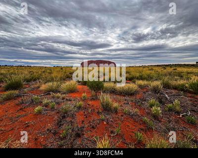 The iconic sandstone monolith stands majestically in the heart of Australia's Red Centre, a sacred site for the Aboriginal people Stock Photo
