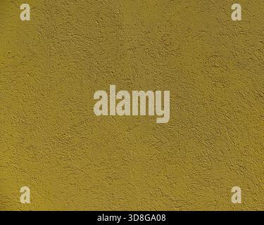 Background texture of wall with silver yellow stucco or cement Stock Photo