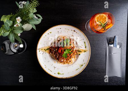 Spaghetti Bolognese with meat sauce, cheese, herbs and toast on a ceramic plate. Rustic table setting. Stock Photo