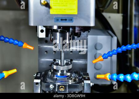 Honing machine for polishing the inner surface of a workpiece hole to achieve smoothness and high precision. Stock Photo