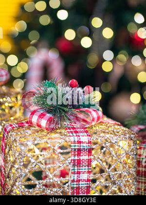 Christmas present tied with ribbon with background of lovely light bokeh Stock Photo