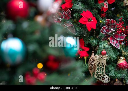 Christmas decoration with colorful balls and ornaments hanging on tree. Stock Photo