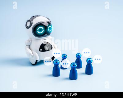 Cute AI robot interacting with chatbot avatars and speech bubbles, symbolizing AI agents, virtual assistants, robotics, and future innovation in artif Stock Photo