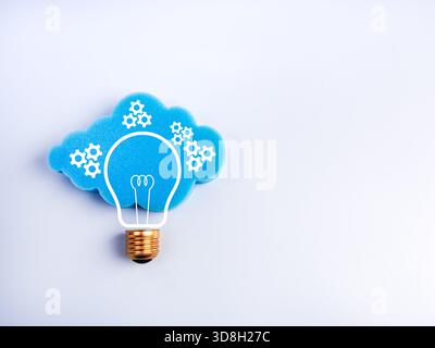 Creative cloud and lightbulb concept with gear icons on white with space, symbolizing smart cloud computing, data management, innovation, intelligent Stock Photo