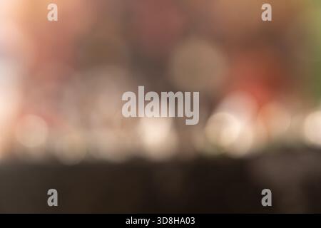Warm and soft-focus abstract background featuring bright, circular bokeh lights in neutral, earthy tones. Ideal for design overlays, headers, Stock Photo