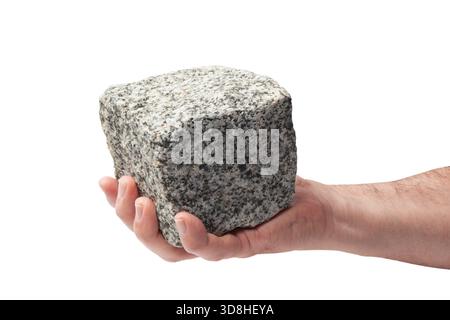 Human hand palm with a pave granite stone cube placed on it Stock Photo