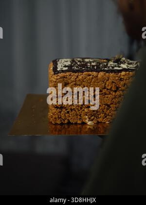 Rectangular Anthill Cake on Gold Cake Board, Low-Light Close-Up Stock Photo